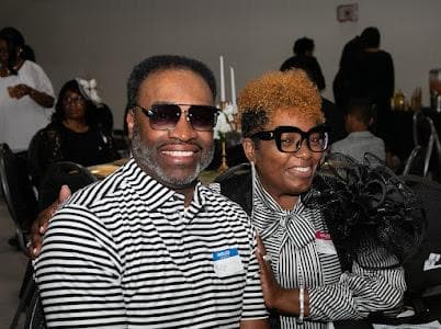 A couple smiles for the camera at the celebration.