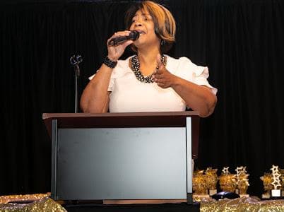 A vocalist performs for guests.