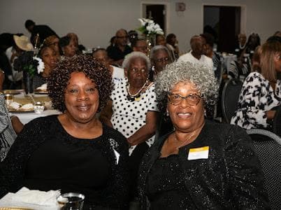 Guests seated at their tables during the celebration.